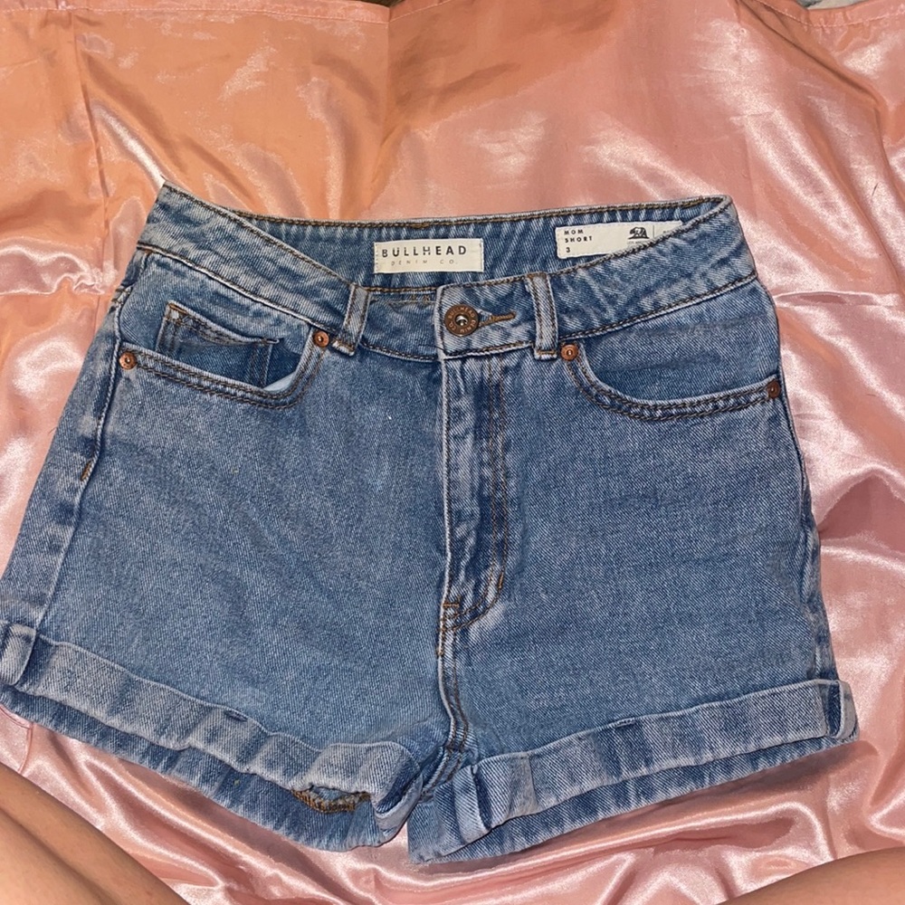 Not stretchy material. Bit of a tough zipper but worth the look of the shorts.
